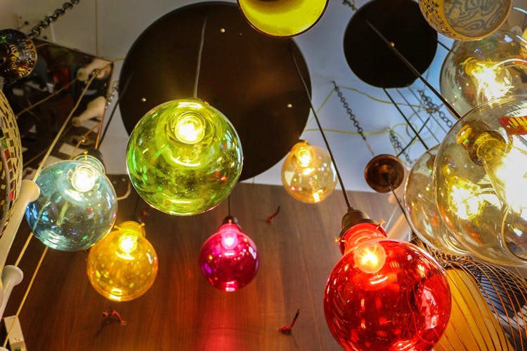 Light,Lighting,Christmas ornament,Lighting accessory,Interior design,Glass,Light fixture