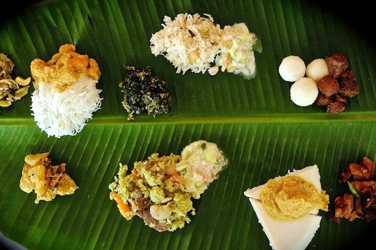Dish,Sadya,Banana leaf rice,Food,Cuisine,Banana leaf,Comfort food,Ingredient,Leaf,Rice