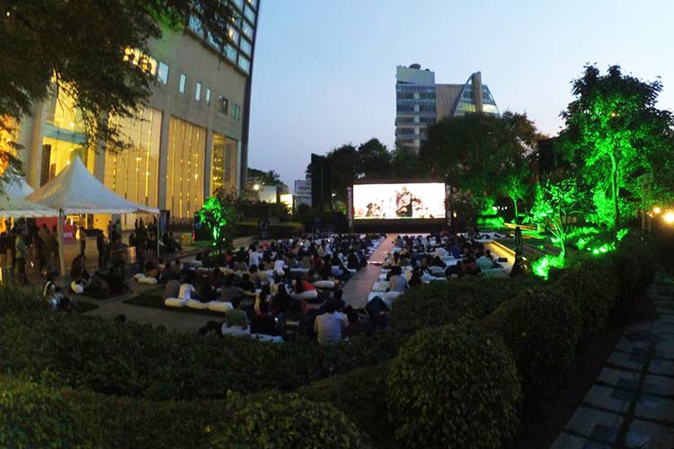Crowd,Night,Metropolitan area,City,Event,Stage,Tree,Architecture,Performance,Photography