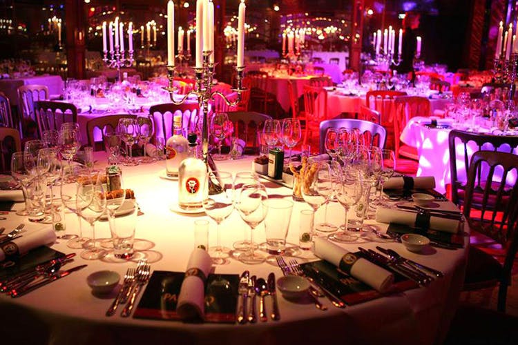 Decoration,Wedding banquet,Function hall,Lighting,Chiavari chair,Pink,Centrepiece,Purple,Rehearsal dinner,Light