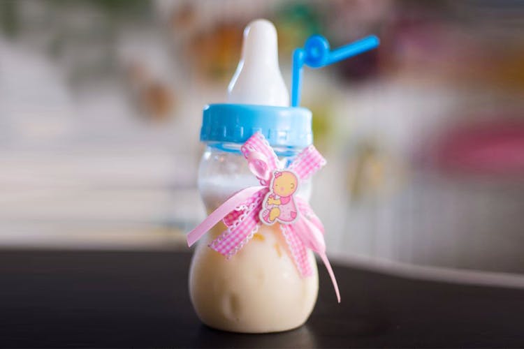Product,Baby bottle,Pink,Baby Products,Plastic bottle,Bottle,Liquid,Plastic,Party favor