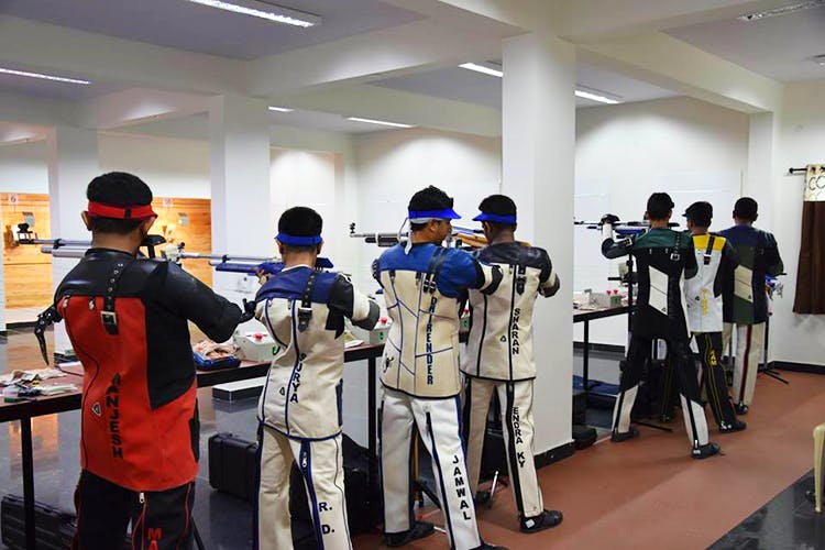 Gun,Shooting sport,Shooting,Recreation,Uniform,Air gun,Firearm,Rifle,Sport venue,Individual sports