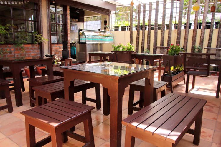 Furniture,Table,Restaurant,Property,Room,Kitchen & dining room table,Café,Building,Outdoor table,Hardwood