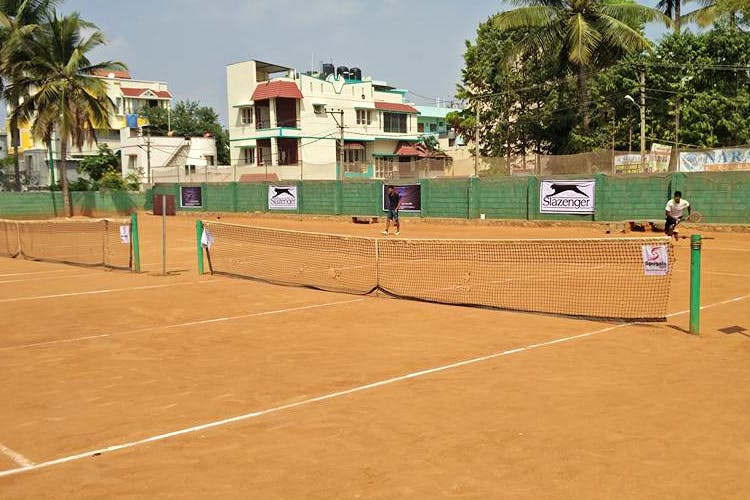 Tennis court,Sport venue,Tennis,Soft tennis,Sports,Tennis player,Net,Racquet sport,Sports equipment,Play