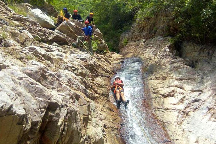Adventure,Outdoor recreation,Climbing,Recreation,Geological phenomenon,Outcrop,Bedrock,Sport climbing,Rock,Ravine