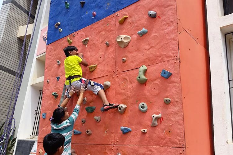 Climbing hold,Sport climbing,Climbing,Adventure,Wall,Free climbing,Bouldering,Climbing harness,Rock climbing,Climbing shoe
