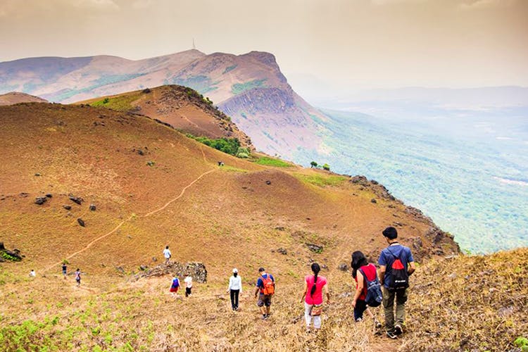 Mountainous landforms,Mountain,Hill,Highland,Wilderness,Ridge,Sky,Grassland,Adventure,Hiking