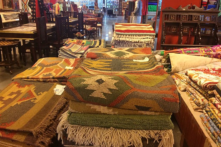 Carpet,Textile,Furniture,Table,Room,Linens,Flooring,Antique,Bed sheet,Collection