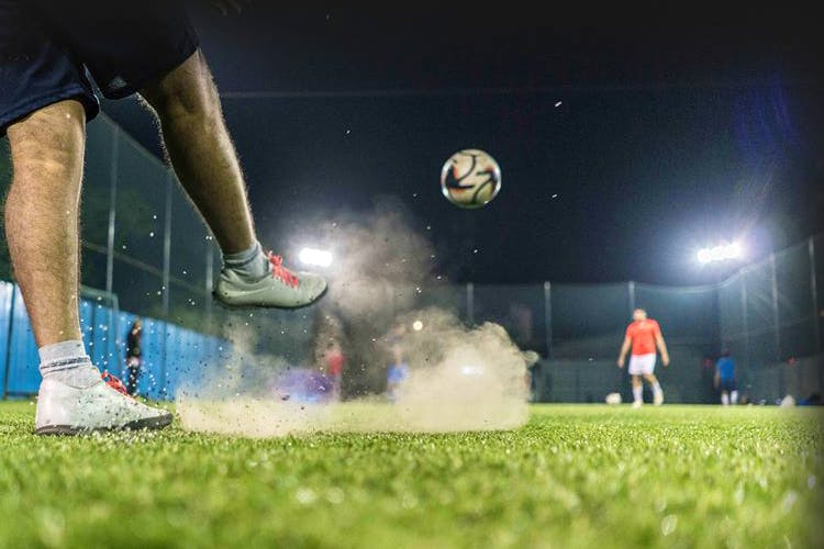 Football,Player,Ball,Grass,Soccer ball,Soccer,Sports equipment,Sports,Football player,Atmosphere
