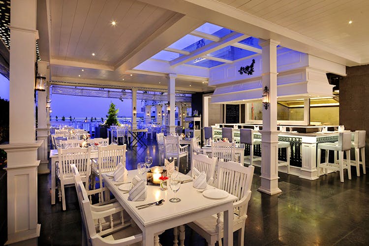 Restaurant,Lighting,Property,Interior design,Building,Room,Ceiling,Table,Design,Function hall