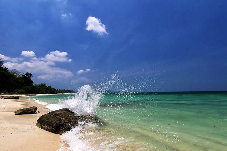 Body of water,Sky,Sea,Wave,Water,Beach,Blue,Nature,Ocean,Tropics