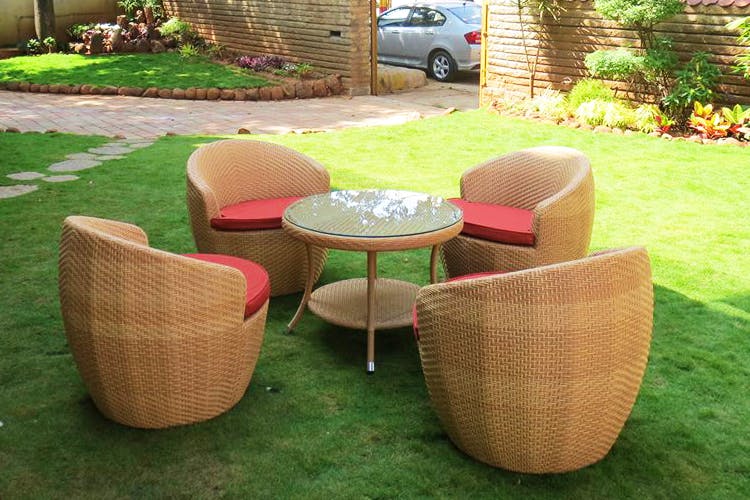 Wicker,Furniture,Table,Outdoor table,Chair,Grass,Lawn,Coffee table,Outdoor furniture,Patio