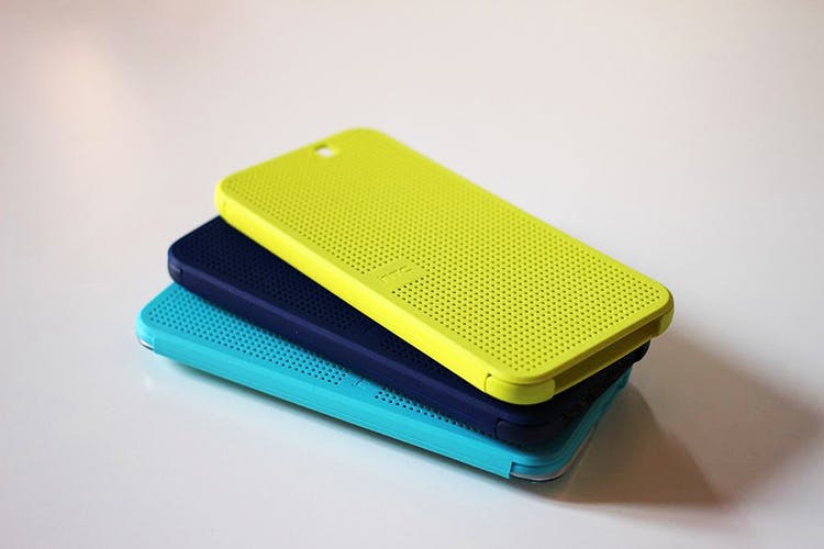 Green,Yellow,Turquoise,Plastic,Technology,Electric blue,Electronic device,Gadget,Rectangle,Wallet