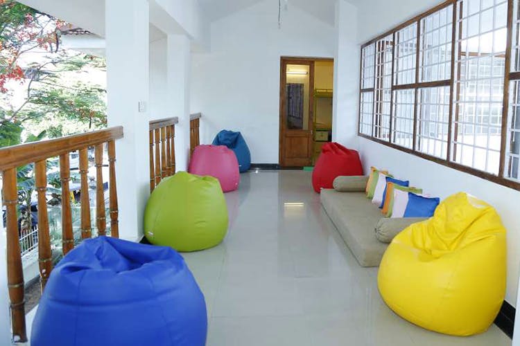 Bean bag,Furniture,Room,Property,Yellow,Real estate,House,Building,Interior design,Bean bag chair