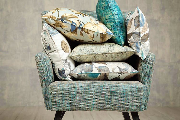 Furniture,Chair,Room,Slipcover,Couch,Interior design,Textile,Comfort,Living room,Club chair