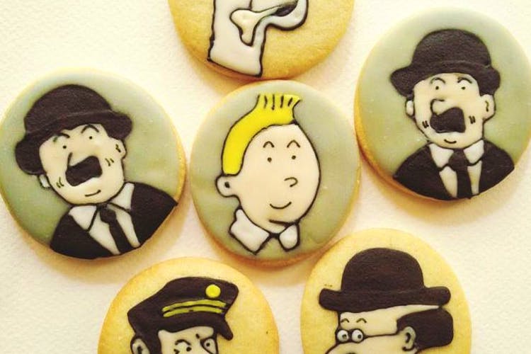 Moustache,Cartoon,Cookie,Headgear,Hat,Snack,Pin-back button,Fashion accessory,Cookies and crackers,Cap