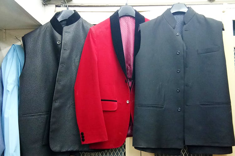 Clothing,Suit,Outerwear,Formal wear,Blazer,Jacket,Pink,Clothes hanger,Design,Tuxedo
