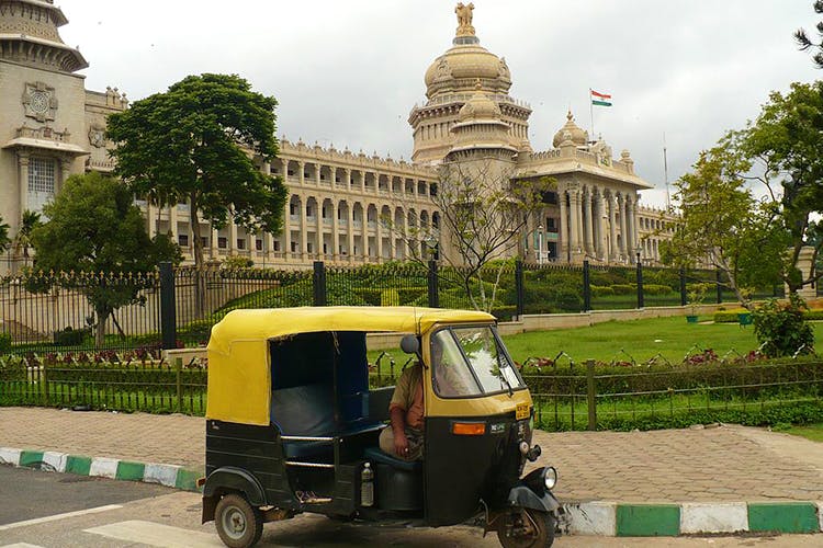 Mode of transport,Vehicle,Transport,Rickshaw,Architecture,Car,Grass,Commercial vehicle,Street,Scooter