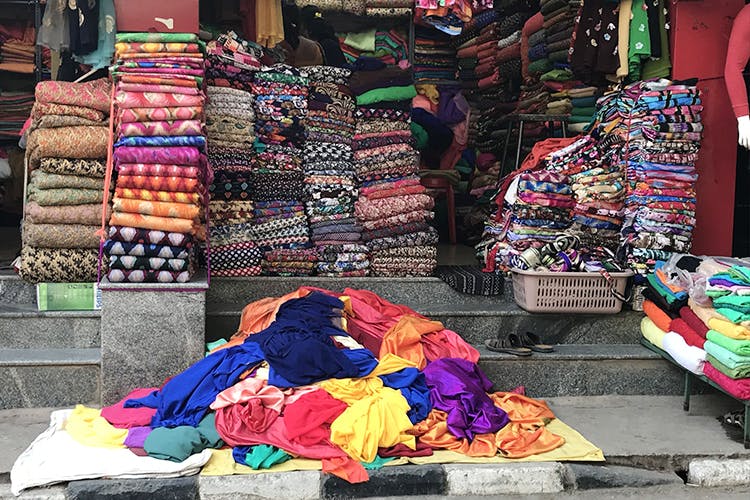 Selling,Bazaar,Market,Public space,Marketplace,Human settlement,Textile,City,Flea market,Street
