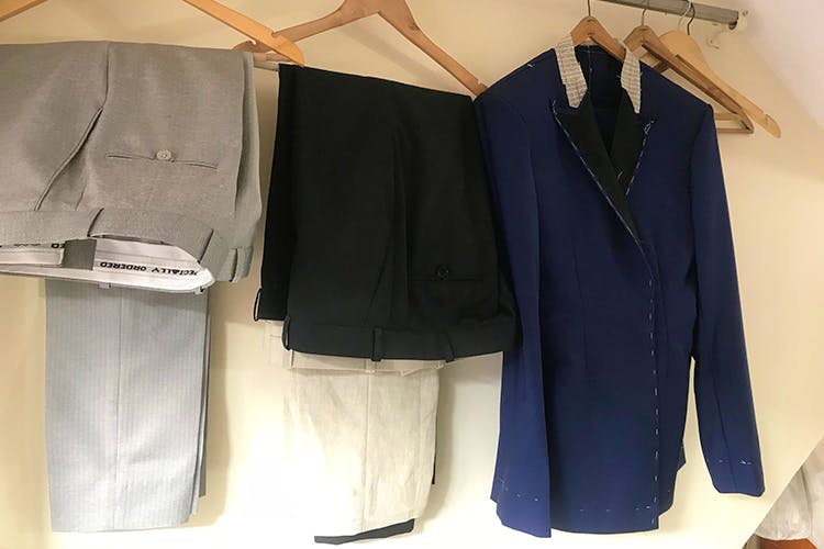 Clothing,Clothes hanger,Suit,Outerwear,Formal wear,Room,Trousers,Blazer