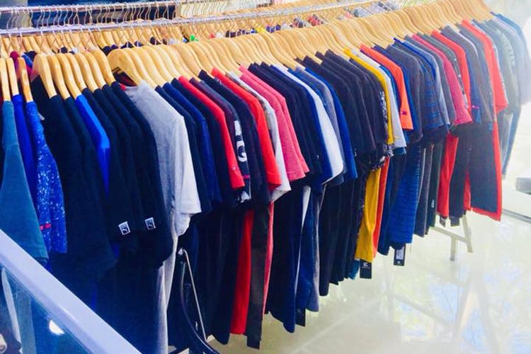 Clothing,Clothes hanger,Room,Sportswear,Outerwear,Closet,Dry cleaning,Uniform