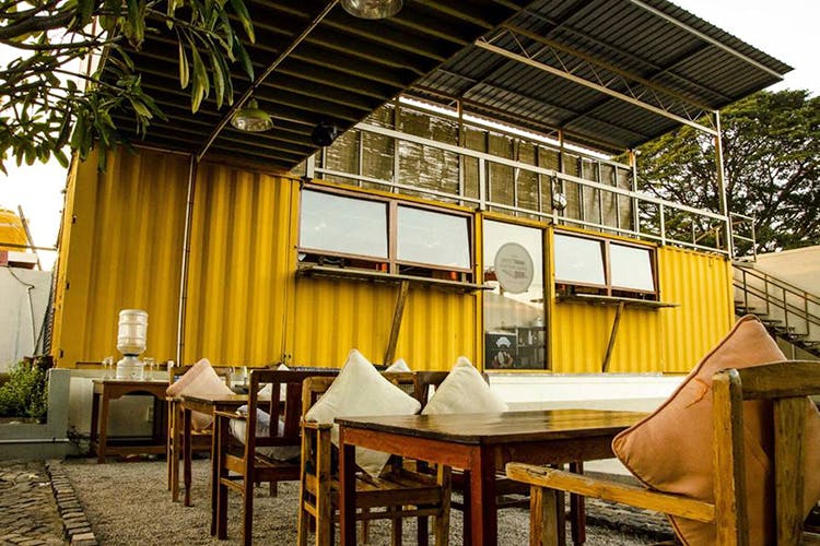 Building,Yellow,Restaurant,Architecture,House,Room,Furniture,Interior design,Table,Home
