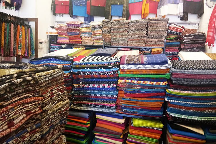 Bazaar,Textile,Public space,Market,Linens,Outlet store,Retail,Marketplace,Building,Wool