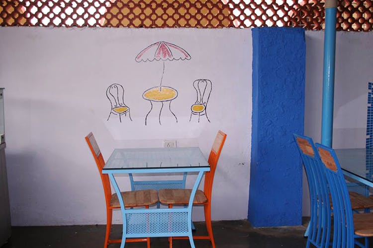 Blue,Yellow,Room,Orange,Wall,Table,Furniture,Chair,Interior design,Wallpaper