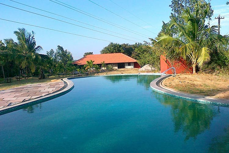 Swimming pool,Property,Water resources,Water,Waterway,Real estate,Resort,House,Tree,Leisure
