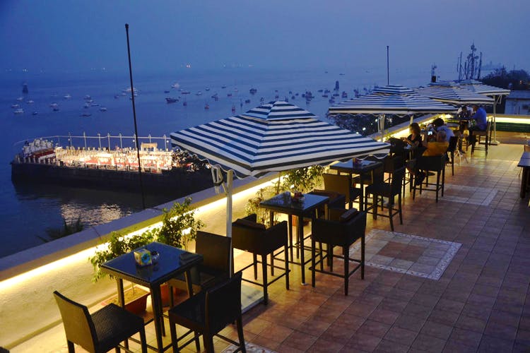 Restaurant,Sea,Roof,Night,Dock,Marina,Architecture,Table,Vacation,Deck