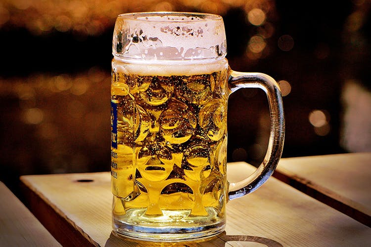Beer glass,Beer,Mug,Drink,Alcoholic beverage,Drinkware,Beer stein,Lager,Pint glass,Yellow
