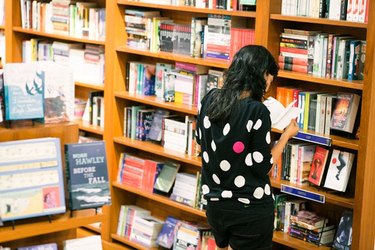 Library,Bookselling,Bookcase,Public library,Book,Shelving,Retail,Publication,Shelf,Building