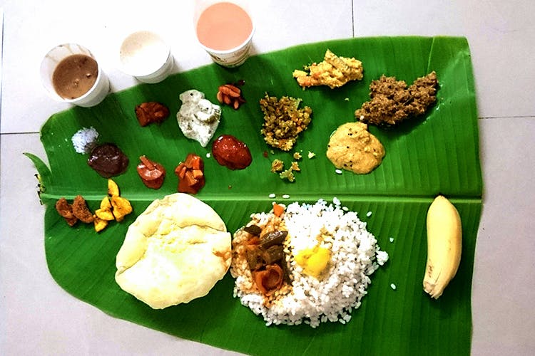 Dish,Food,Cuisine,Sadya,Banana leaf rice,Banana leaf,Andhra food,Ingredient,Leaf,Vegetarian food