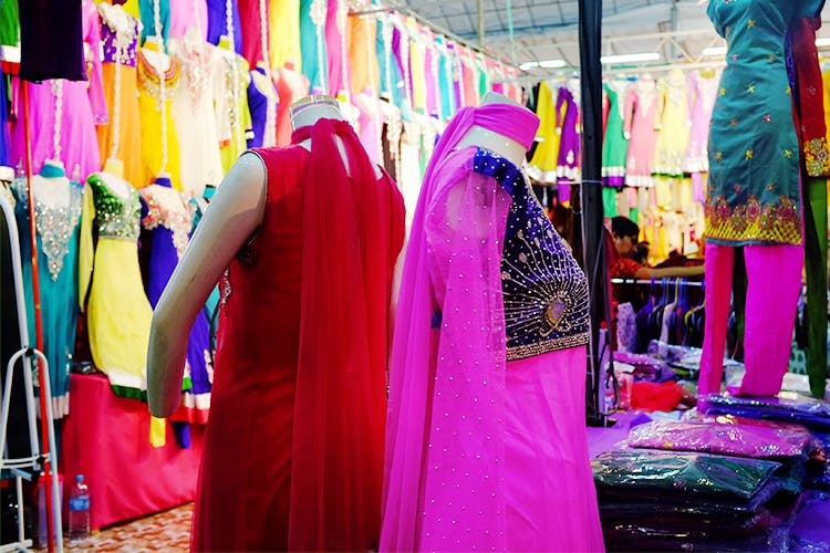 Pink,Clothing,Boutique,Magenta,Bazaar,Public space,Purple,Dress,Textile,Market