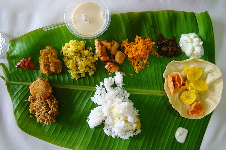 Dish,Food,Cuisine,Sadya,Banana leaf rice,Banana leaf,Ingredient,Leaf,Rice,Andhra food