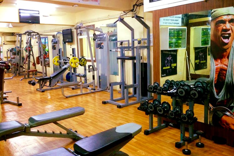Gym,Sport venue,Room,Physical fitness,Weight training,Exercise equipment,Weightlifting machine,Exercise,Bench,Fitness professional