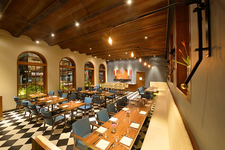 Restaurant,Building,Interior design,Room,Architecture,Dining room,Function hall,Real estate,Table,Cafeteria