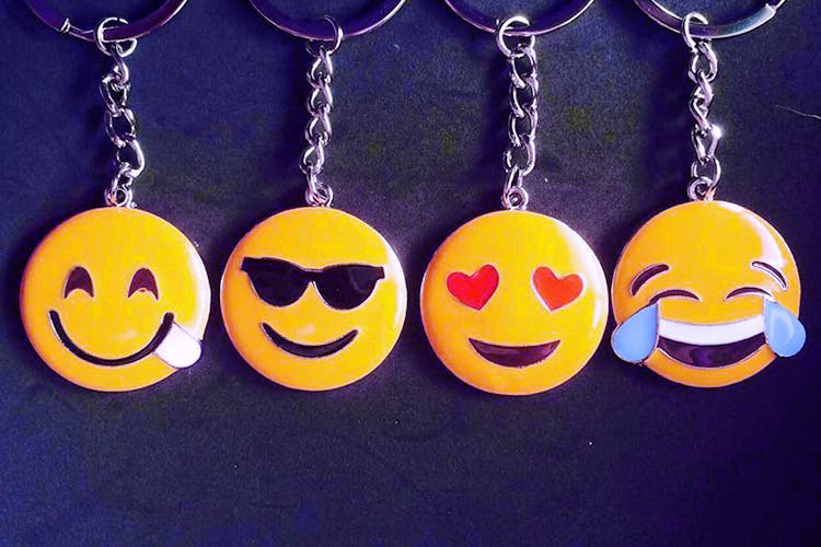 Keychain,Smile,Emoticon,Facial expression,Yellow,Smiley,Fashion accessory,Mouth,Happy,Icon