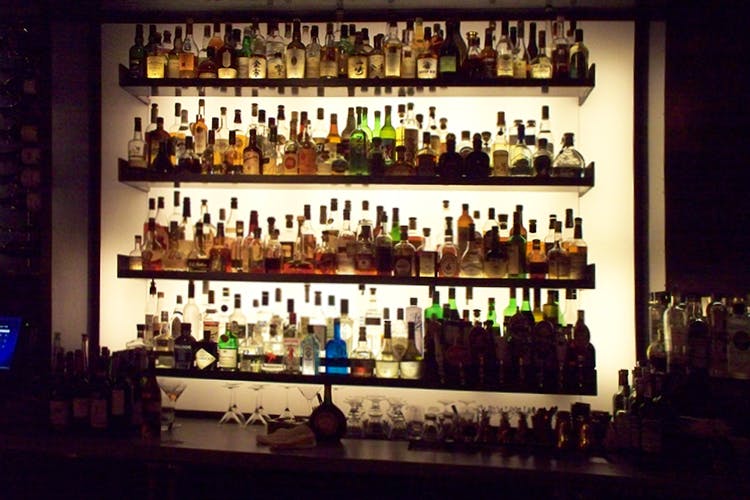 Alcohol,Bar,Drinking establishment,Distilled beverage,Drink,Liqueur,Alcoholic beverage,Glass bottle,Building,Pub
