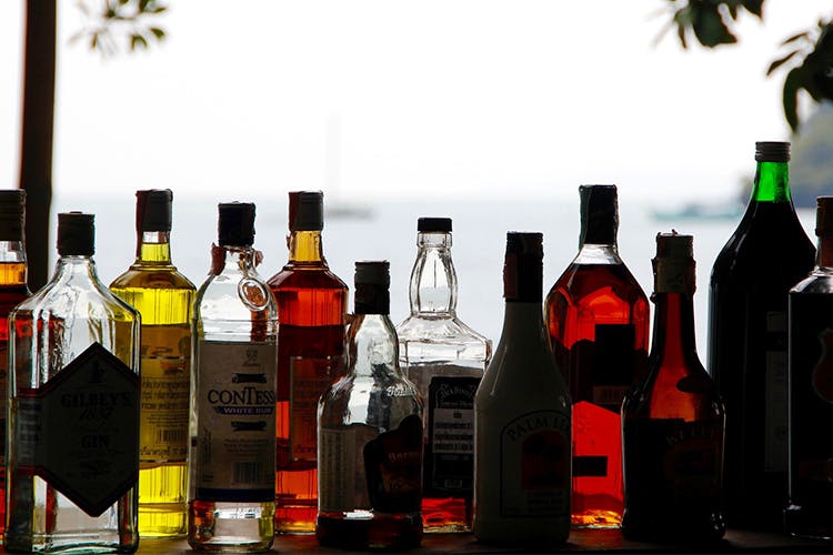 Bottle,Alcohol,Glass bottle,Liqueur,Drink,Product,Distilled beverage,Red,Wine bottle,Alcoholic beverage