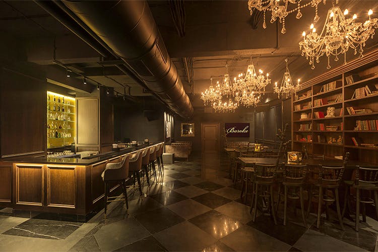 Lighting,Building,Room,Architecture,Interior design,Restaurant,Night,Bar,Furniture,Table