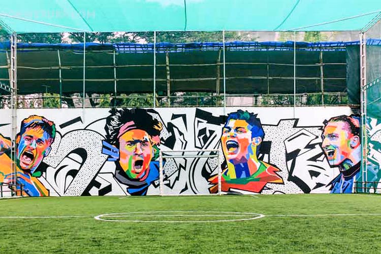 Art,Mural,Graffiti,Street art,Grass,Stadium,Wall,Sport venue,Player,Goal