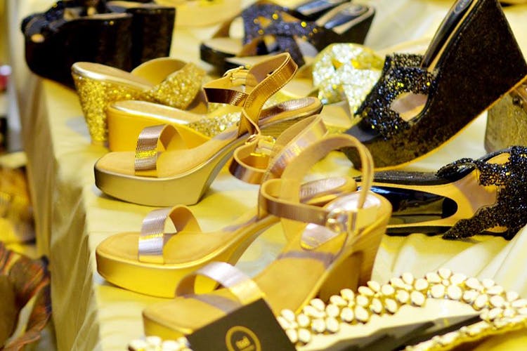 Footwear,Yellow,Shoe,Gold,Metal,High heels,Fashion accessory,Shoe store