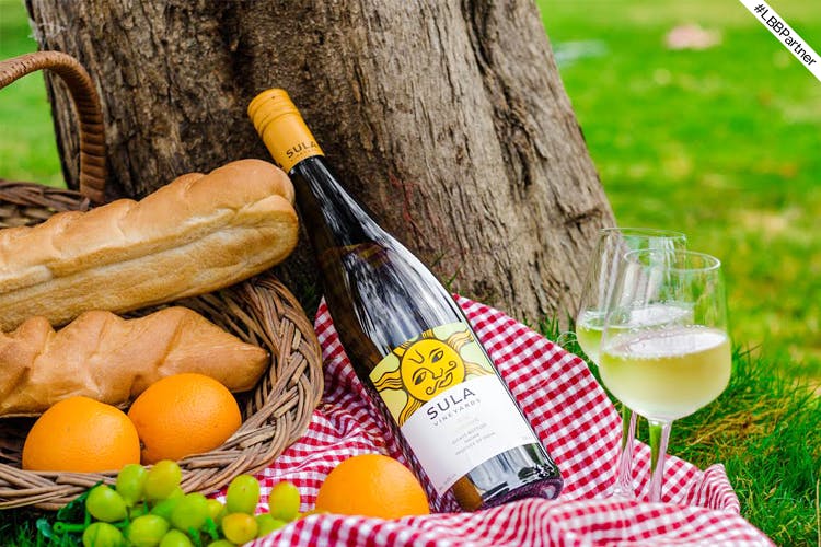 Picnic,Drink,Food,Recreation,Glass bottle,Picnic basket,Liqueur,Bottle,Still life,Wine bottle