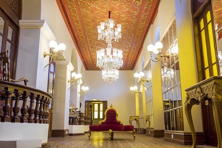 Building,Yellow,Interior design,Architecture,Lobby,Ceiling,Room,Palace,Furniture,Chapel