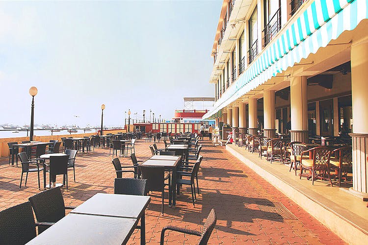 Building,Architecture,Restaurant,Walkway,Vacation,Real estate,City,Mixed-use,Table,Sea