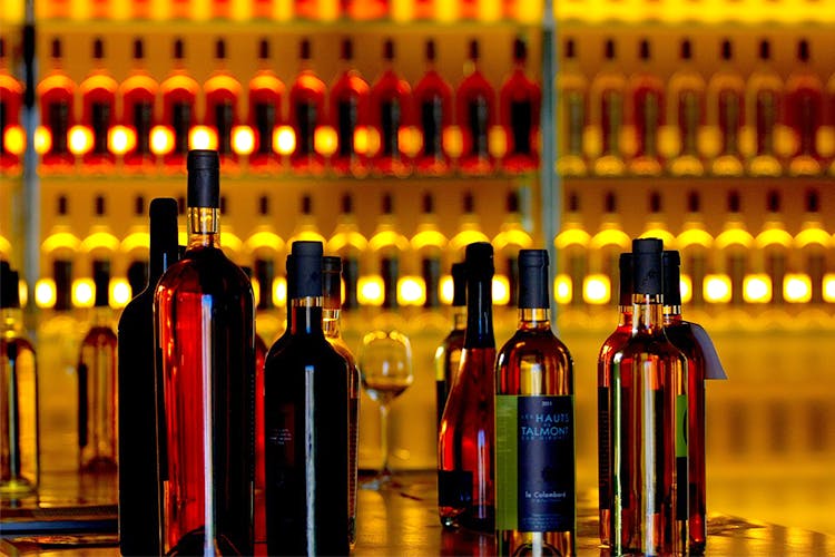 Bottle,Wine bottle,Alcohol,Glass bottle,Drink,Liqueur,Yellow,Alcoholic beverage,Distilled beverage,Wine