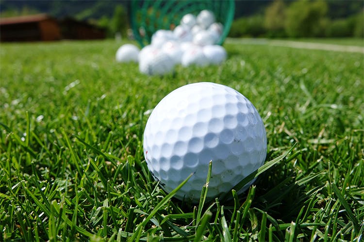 Golf ball,Golf equipment,Grass,Golf,Ball,Sports equipment,Pitch and putt,Tee,Competition event,Sport venue
