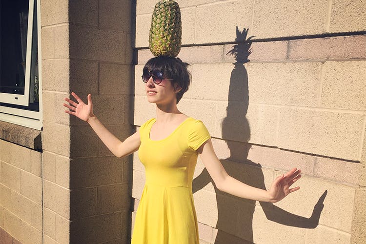 Yellow,Standing,Shoulder,Snapshot,Wall,Dress,Finger,Smile,Shadow,Photography