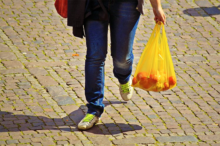 Yellow,Leg,Human leg,Snapshot,Orange,Cobblestone,Footwear,Jeans,Road surface,Walking